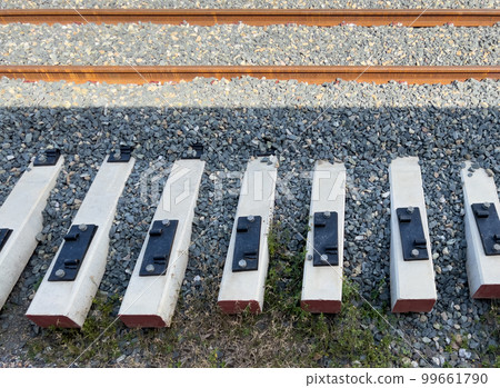 The new railway sleepers are laid beside the railway. The new railway sleepers are laid beside the railway. 99661790
