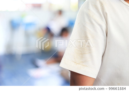 dirty stain on part of shirt from daily life activity for cleaning concept. selective focus. 99661884