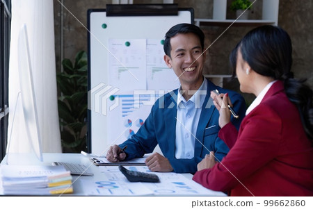 Young Asian business team creative businesspeople coworker in office. Meeting Presentation for tax analysis graph company financial. People Work in Business Office Young Asian business team creative businesspeople coworker in office. Meeting Presentation for tax analysis graph company financial. People Work in Business Office 99662860