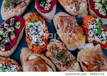 Dessert buffet at small wedding reception outside in the backyard. 99663129