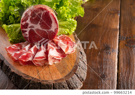 Capocollo or coppa is a traditional Italian and Corsican pork Capocollo or coppa is a traditional Italian and Corsican pork 99663214