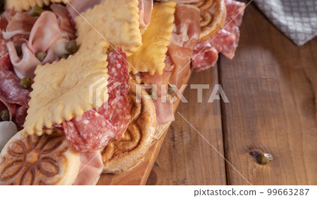 Crescentina. Food of Emilia Romagna region, deep fried bread gnocco fritto or crescentina. Starter Crescentina. Food of Emilia Romagna region, deep fried bread gnocco fritto or crescentina. Starter 99663287