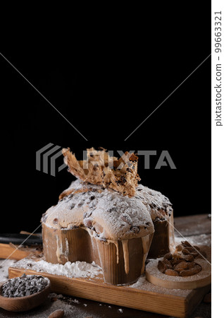 Colomba with chocolate. Easter Italian cake with almonds and chocolate in the shape of a dove.  99663321