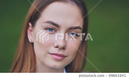 Portrait of an 18-year-old girl. Close-up of her face. 99663841