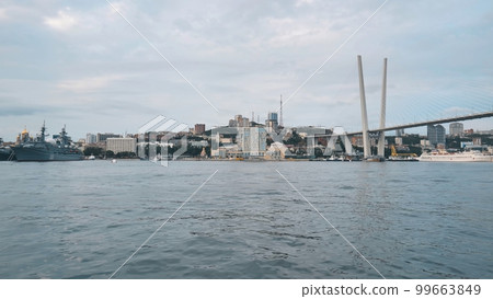 Panorama of the Russian city of Vladivstok. View from the moving ferry. Panorama of the Russian city of Vladivstok. View from the moving ferry. 99663849