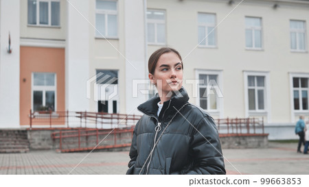 Spinning around a lonely girl in the middle of town. 99663853