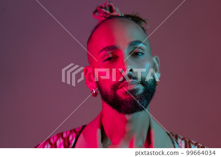 Black man in neon studio light Black man in neon studio light 99664034