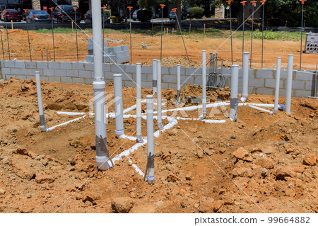 Under foundation of new home it will be necessary to install utilities, such as water and sewer pipes, in ground underground Under foundation of new home it will be necessary to install utilities, such as water and sewer pipes, in ground underground 99664882