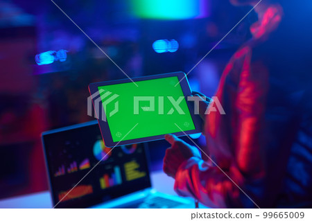 Seen from behind modern business woman with digital tablet Seen from behind modern business woman with digital tablet 99665009