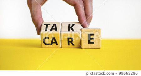 Take care symbol. Businessman turns wooden cubes and changes the word take to care. Beautiful yellow table, white background, copy space. Business and take care concept. Take care symbol. Businessman turns wooden cubes and changes the word take to care. Beautiful yellow table, white background, copy space. Business and take care concept. 99665286