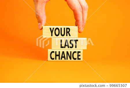 Time to your last chance symbol. Concept words Your last chance on wooden blocks on a beautiful orange table orange background. Businessman hand. Business and your last chance concept. Copy space. Time to your last chance symbol. Concept words Your last chance on wooden blocks on a beautiful orange table orange background. Businessman hand. Business and your last chance concept. Copy space. 99665307