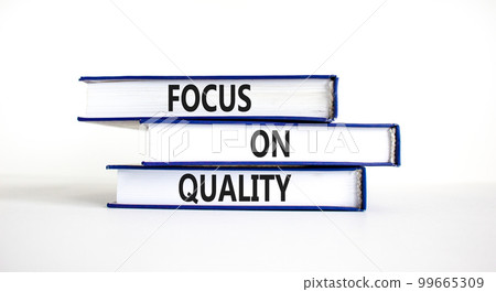 Focus on quality symbol. Concept words Focus on quality on books on beautiful white table white background. Business, focus on quality concept. Copy space. 99665309