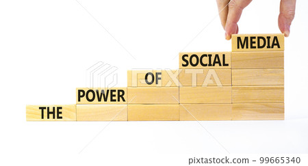 Power of social media symbol. Wooden blocks with words The power of social media. Beautiful white background, copy space. Businessman hand. Business, power of social media concept. Power of social media symbol. Wooden blocks with words The power of social media. Beautiful white background, copy space. Businessman hand. Business, power of social media concept. 99665340