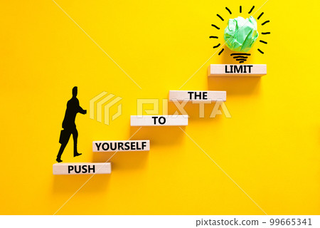 Push the limit symbol. Concept words Push yourself to the limit on wooden blocks. Beautiful yellow table yellow background. Businessman icon. Business push the limit concept. Copy space. Push the limit symbol. Concept words Push yourself to the limit on wooden blocks. Beautiful yellow table yellow background. Businessman icon. Business push the limit concept. Copy space. 99665341