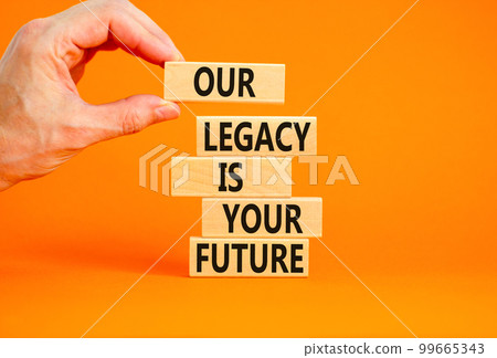 Legacy and future symbol. Concept words Our legacy is your future on wooden blocks. Beautiful orange table orange background. Businessman hand. Business legacy and future concept. Copy space. Legacy and future symbol. Concept words Our legacy is your future on wooden blocks. Beautiful orange table orange background. Businessman hand. Business legacy and future concept. Copy space. 99665343