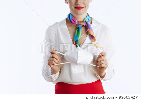 Closeup on stylish female stewardess on white Closeup on stylish female stewardess on white 99665427