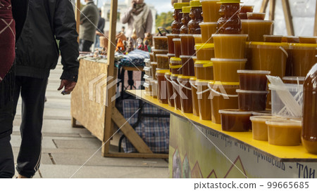 jars of flower honey are placed in a row, soft focus jars of flower honey are placed in a row, soft focus 99665685