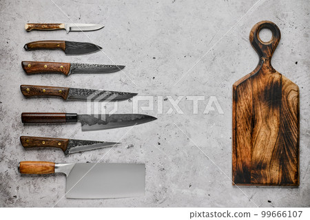 Different kinds of knives and cutting board 99666107