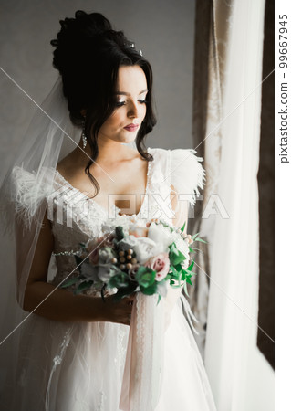 Beautiful fashion bride in wedding dress posing Beautiful fashion bride in wedding dress posing 99667945