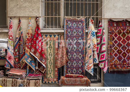 Various Anatolian rugs on street market Various Anatolian rugs on street market 99668367