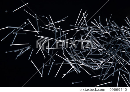 Long Nail fly floating in mid air. Many group screw nails short long metal fall as construction tools. Black background isolated. New Screwdriver Nail fall down unbox steel hardware work Long Nail fly floating in mid air. Many group screw nails short long metal fall as construction tools. Black background isolated. New Screwdriver Nail fall down unbox steel hardware work 99669540