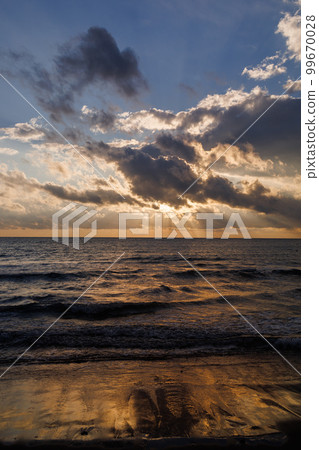 Colorful ocean beach sunrise. 99670028