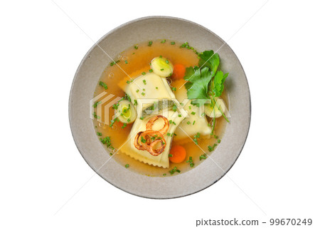 Delicious soup with Swabian ravioli topped with roasted onion rings isolated on white background Delicious soup with Swabian ravioli topped with roasted onion rings isolated on white background 99670249
