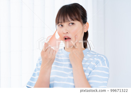 Women suffering from skin problems caused by masks Women suffering from skin problems caused by masks 99671322