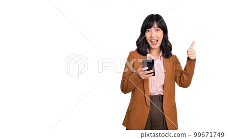 Surprised beautiful young Asian lady using mobile phone with positive expression, smiles broadly, dressed in casual clothing on white background. Happy adorable glad woman rejoices success Surprised beautiful young Asian lady using mobile phone with positive expression, smiles broadly, dressed in casual clothing on white background. Happy adorable glad woman rejoices success 99671749