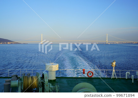 Wake of a ferry passing through Awaji Island and the Akashi Kaikyo Bridge Wake of a ferry passing through Awaji Island and the Akashi Kaikyo Bridge 99671894