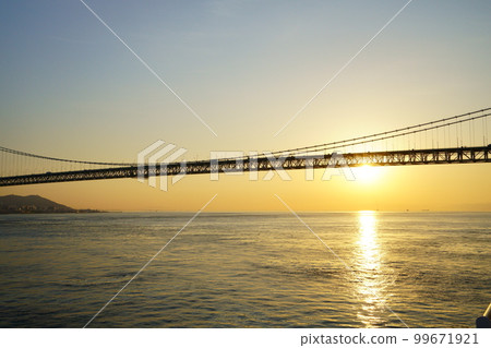 Akashi Kaikyo Bridge, Mt. Hachibuse and the rising sun seen from the sea Akashi Kaikyo Bridge, Mt. Hachibuse and the rising sun seen from the sea 99671921