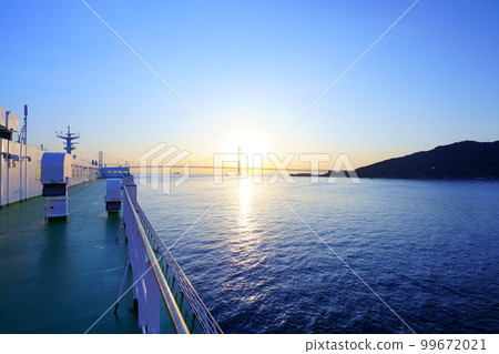 Sunrise over the Akashi Kaikyo Bridge seen from the ferry Sunrise over the Akashi Kaikyo Bridge seen from the ferry 99672021