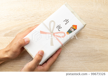 Family celebration gifts at hand 99673326