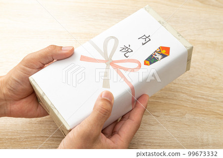 Family celebration gifts at hand 99673332