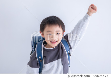 A first grader doing a guts pose A first grader doing a guts pose 99674473