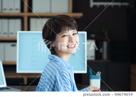 Young woman working in the office 99674654