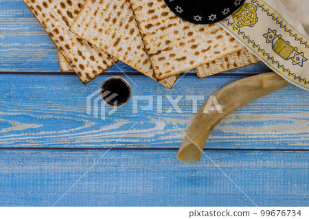 For Pesach unleavened matzah bread is eaten and kosher kiddush cup wine is used to celebrate holiday. For Pesach unleavened matzah bread is eaten and kosher kiddush cup wine is used to celebrate holiday. 99676734
