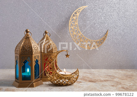 Muslim Holy Month Ramadan Kareem - Ornamental Arabic Lantern With Burning Candle Muslim Holy Month Ramadan Kareem - Ornamental Arabic Lantern With Burning Candle 99678122