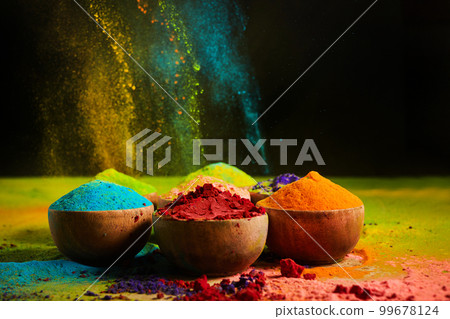 Colorful traditional Holi powder in bowls. Happy Holi. Concept Indian color festival. Colorful traditional Holi powder in bowls. Happy Holi. Concept Indian color festival. 99678124