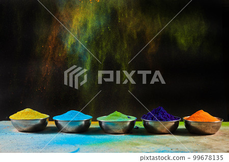 Colorful traditional Holi powder in bowls. Happy Holi. Concept Indian color festival. Colorful traditional Holi powder in bowls. Happy Holi. Concept Indian color festival. 99678135