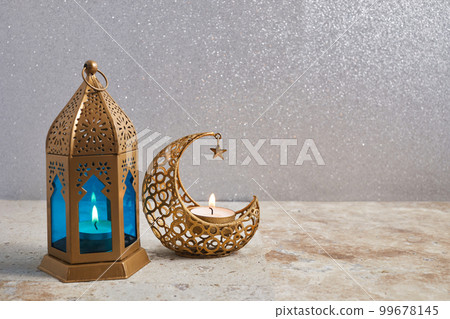 Muslim Holy Month Ramadan Kareem - Ornamental Arabic Lantern With Burning Candle Muslim Holy Month Ramadan Kareem - Ornamental Arabic Lantern With Burning Candle 99678145