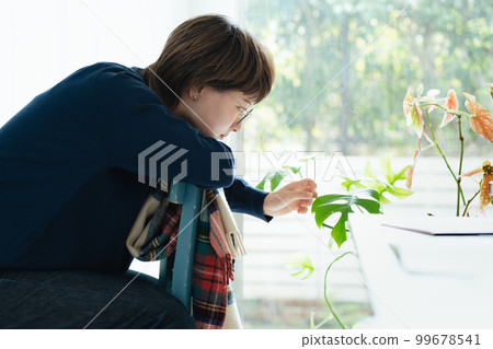 Young woman playing with green Young woman playing with green 99678541
