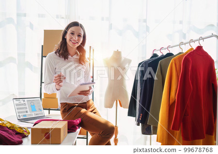 Portrait of Small Business SME owners live stream by smart phone. Online shopping concept 99678768