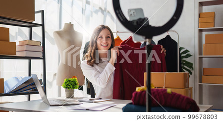 Portrait of Small Business SME owners live stream by smart phone. Online shopping concept 99678803