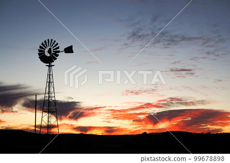 Australia's vivid sky and windmill silhouette Australia's vivid sky and windmill silhouette 99678898