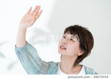 Portrait of a young woman worried about UV rays 99679344