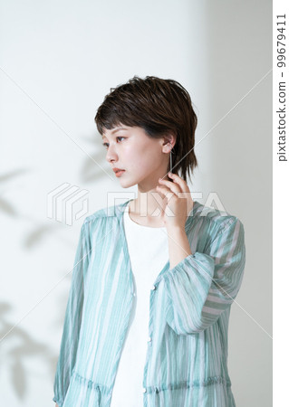 Portrait of a young woman worried about UV rays Portrait of a young woman worried about UV rays 99679411