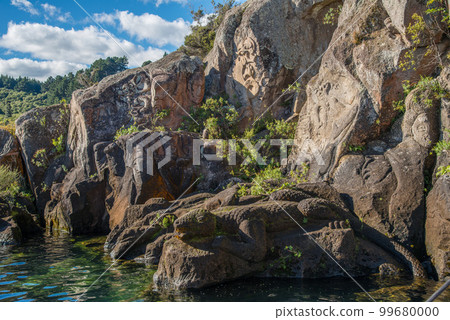 The Maori rock carvings the iconic tourist attraction place in lake Taupo the largest fresh water lake in New Zealand. The Maori rock carvings the iconic tourist attraction place in lake Taupo the largest fresh water lake in New Zealand. 99680000