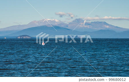 The scenery view of Tongariro national park view from lake Taupo the largest fresh water lake in New Zealand. 99680012