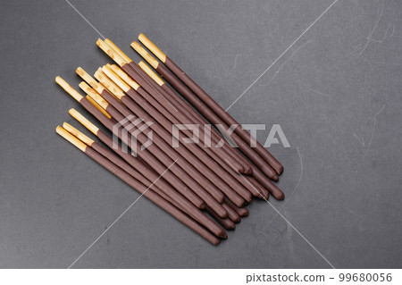 dark chocolate stick on black background  dark chocolate stick on black background  99680056